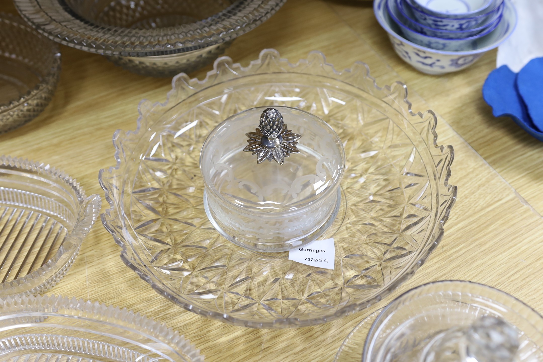 A selection of various late Georgian cut glass dishes, and a later silver mounted pineapple lidded pot and others